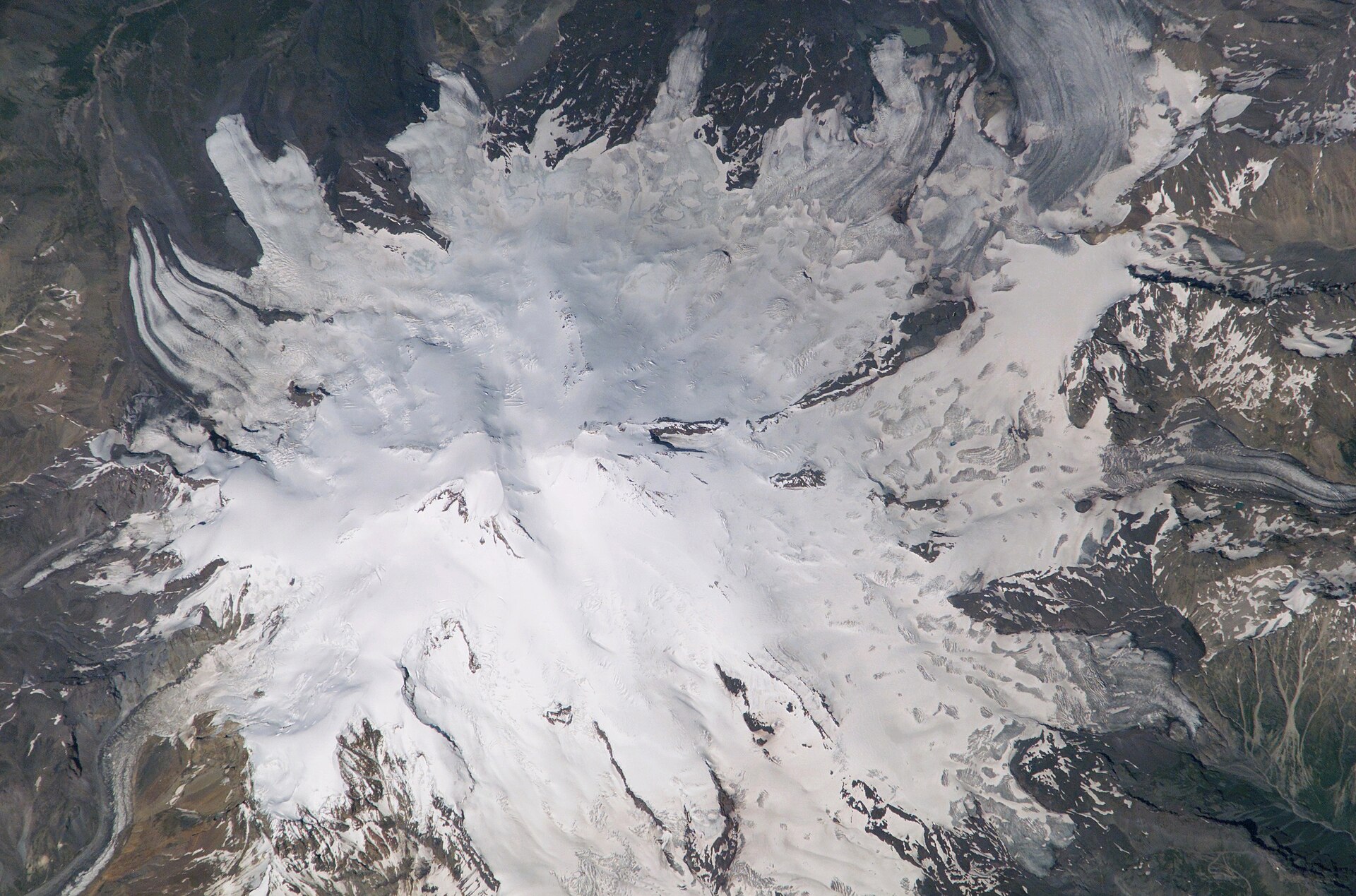 The Caucasus Mountains form a long (more than 1200 km) and steep spine connecting the Black Sea to the Caspian. Mt. Elbrus, the summit of th
