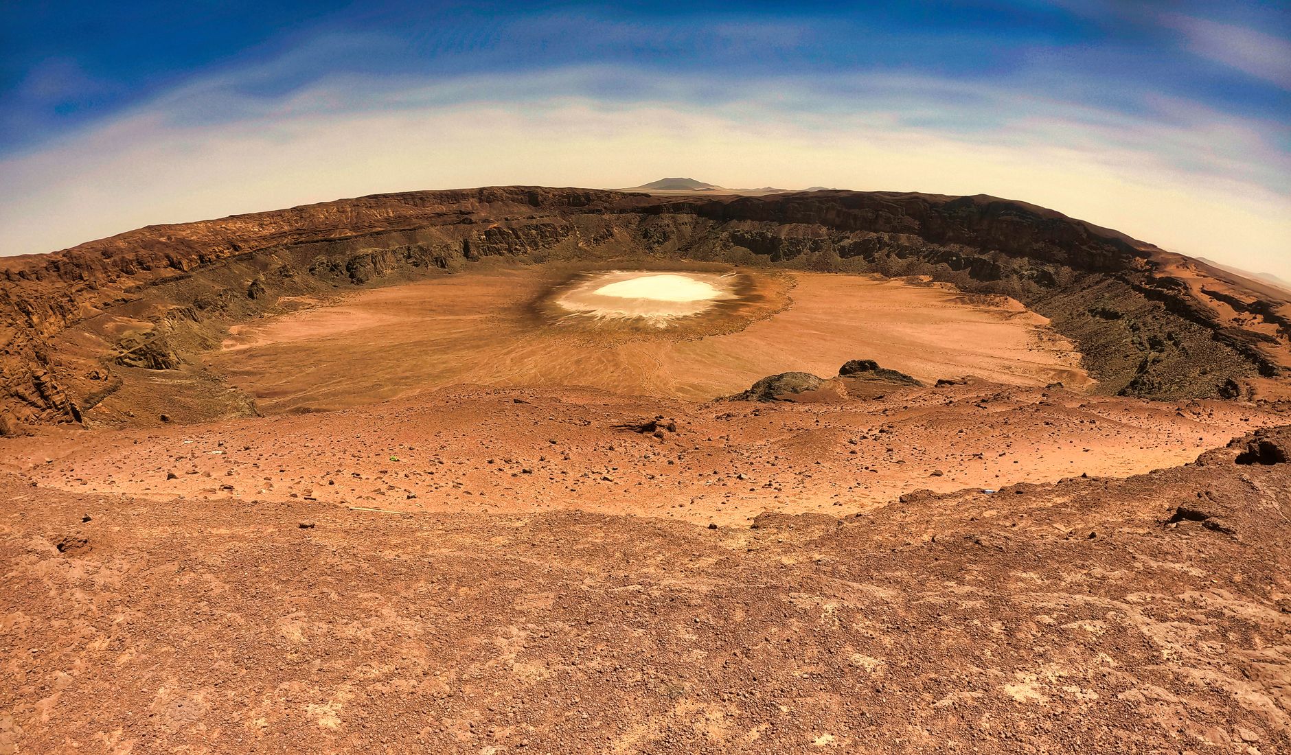 Discover the stunning Al Wahbah Crater in the vast desert of Saudi Arabia.